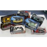 Diecast Models. A collection of eleven boxed mostly 1:18 scale model cars, makers include Ricko,