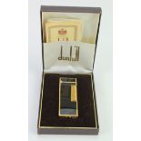 Dunhill black enamel and gold plated Rollagas lighter, with documents, contained in original case