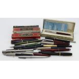 Pens. A group of approximately twenty-four fountain pens, ballpoint pens, pencils, etc., makers