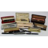 Fountain Pens. A collection of approximately twenty-two fountain pens, ball point pens, pencils,