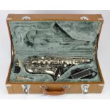 Saxophone. A cased saxophone with makers logo to side of bell, length 47cm approx. (including