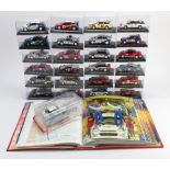 Diecast. Twenty four cased diecast rally cars by De Agostini, together with a folder of related
