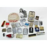 Lighters. A collecton of approximately twenty-five lighters, including Zippo, etc., together with