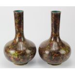 Cloisonne. A pair of Japanese bottle shaped cloisonne vases (probably Meiji), decorated with