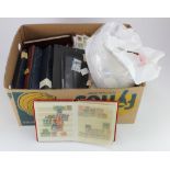 Banana box with stamps on leaves, in albums, stock books, on paper etc etc. Heavy lot. (Buyer