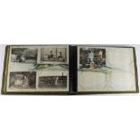 Black lacquer album with decorated pages, containing Japanese postcards   (approx 30)