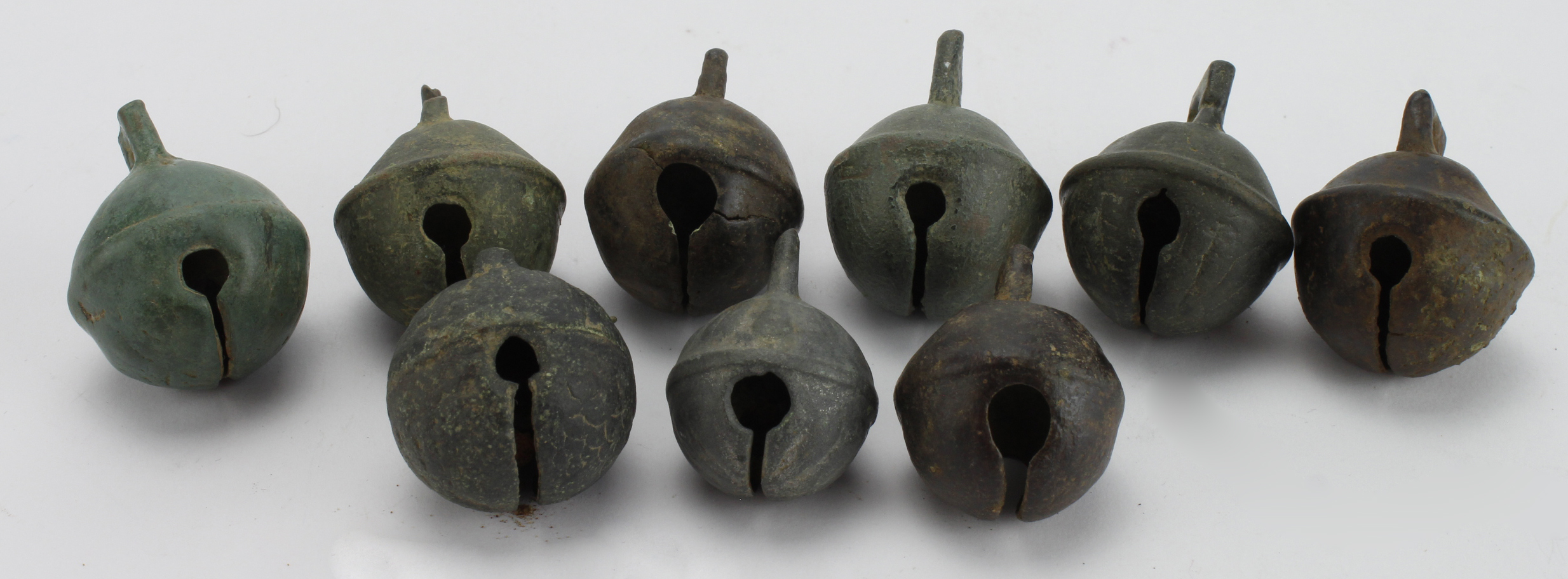 Artefacts: A collection of 9x crotal bells.