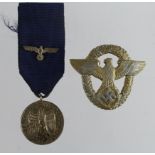 German Nazi Army 4 Year Service Medal with eagle emblem to ribbon, with a Nazi Police Badge (one pin