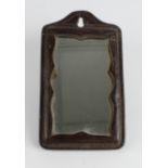 WW1 Trench Mirror with heavy leather surround, reverse named 'Phil Dupuis Rd C.DAC France. W.R.M.