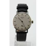 Gents Longines manual wind wristwatch. The 32mm cream dial with black baton markers. Working when