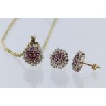 9ct yellow gold pendant and earring suite set with diamond's and rubies, pendant set with eighteen