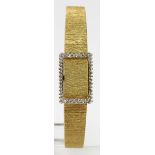 Ladies 18ct Longines wristwatch (hallmarked 1978). On an 18ct integral bracelet with diamond bezel