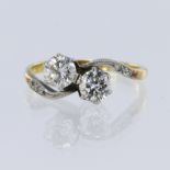 Stamped '18CT PLAT' yellow and white metal diamond 'Toi et Moi' ring, set with two European cut