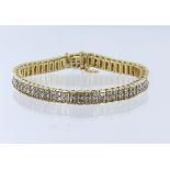 Yellow and white metal (tests 14ct) diamond double row line bracelet, set with 122 round brilliant