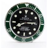 Advertising Wall Clock. Green 'Rolex' advertising wall clock, black dial reads 'Rolex Oyster