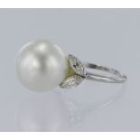 Platunim ring set with a central south sea cultured pearl measuring approx 15mm, and four surround