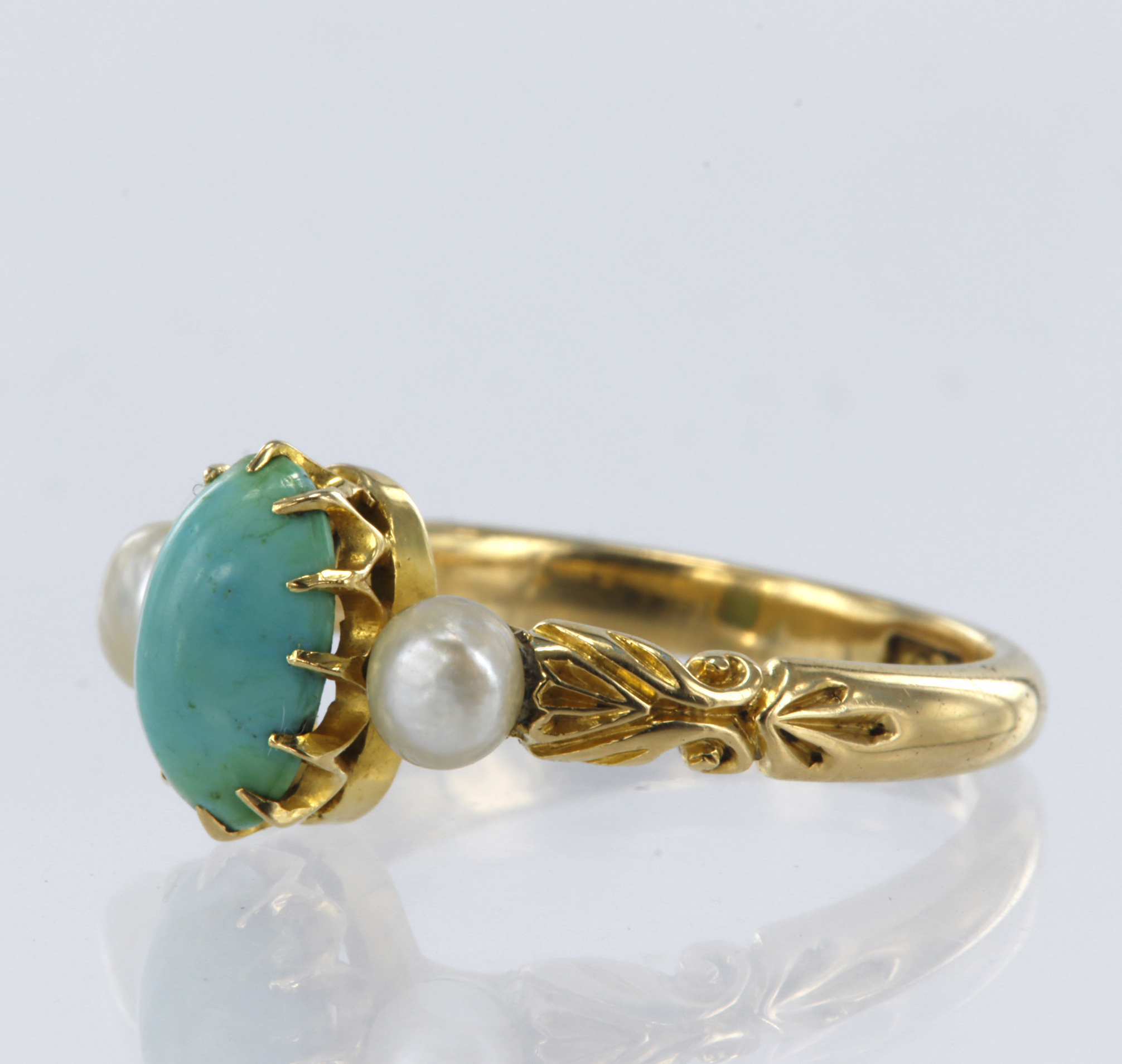 Stamped 18CT yellow metal turquoise and pearl trilogy ring, flanked with engraved shoulders, - Image 2 of 2