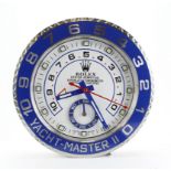 Advertising Wall Clock. Blue 'Rolex' style advertising wall clock (Yacht-Master II) with a white