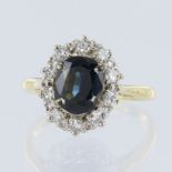 Yellow metal (Tests over 15ct) teal sapphire and diamond cluster ring, oval cut sapphire measures