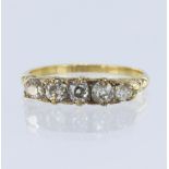 Yellow metal tests 18ct diamond boat shaped ring, set with five old cut diamonds total weight approx