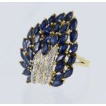 Test 18ct yellow gold cluster ring, set with marquise sapphires, highlighted with diamond points.