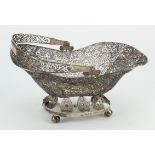 Silver filigree basket with handle, on four ball feet, dutch hallmarked '1815', length 27cm approx.,