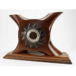 Propeller boss clock, with Arabic numerals to dial, dial reads 'James Walker', mounted on an oak