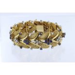 Tests 18ct yellow gold bracelet, set with diamond's and sapphiress, one diamond missing, fourty-