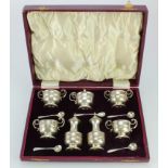 Silver seven piece cruet set and five spoons, hallmarked 'W.E.T, Birmingham 1905', all with matching