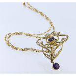 Stamped '9ct' yellow metal, early 20th century Lavalier pendant set with seed pearls and amethyst (