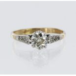 Yellow and white metal (tests 15ct) diamond solitaire ring, old European cut diamond, total