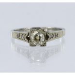 Stamped '18ct' white metal diamond solitaire ring, old-cut cushion diamond total diamond weight