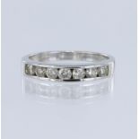 18ct white gold diamond set half eternity band, set with seven round brilliant cut diamonds, total