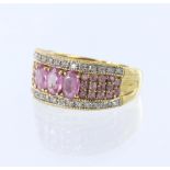 18ct yellow gold band ring featuring three oval pink sapphires measuring approx. 5mm x 3.5mm, with