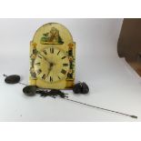 Wag o the wall clock, wood dial with Roman numerals and floral pillar to either side, height 45cm,