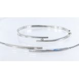 18ct white gold omega link collar with central solid panel in a crossover design with one half