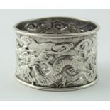 Chinese silver napkin ring with two embossed dragons, the ring is marked with Chinese marks and
