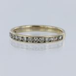 White metal tests 18ct diamond half eternity ring, set with fifteen round brilliant cut diamonds,