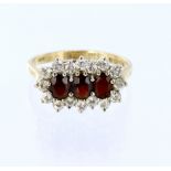 9ct yellow gold triple cluster set with garnets and cz, finger size Q/R, weight 3.4g