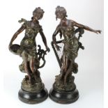 A pair of French Art Nouveau style spelter figures of muses holding their attributes. After L F