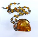 Silver and amber necklace featuring a large heart pendant measuring approx. 45mm x 40mm with a