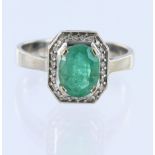 White metal tests 14ct emerald and diamond cluster ring, oval cut emerald approx weight 1.51ct,