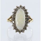 9ct yellow gold cluster ring set with a central elongated oval opal measuring approx. 15mm x 8mm,