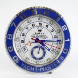 Advertising Wall Clock. Blue 'Rolex' style advertising wall clock (Yacht-Master II) with a white