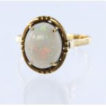 9ct yellow gold ring set with a single opal cabochon measuring approx. 12mm x 10mm, finger size R,