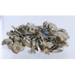 Silver / white metal charm bracelet with a large number of charms attached. Total weight 215.3g