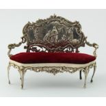 Silver dolls house sofa, ornately decorated with a classical scene back rest, hallmarked 'W.C,