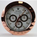 Advertising Wall Clock. Rose gold 'Rolex' style advertising wall clock, white dial reads 'Rolex