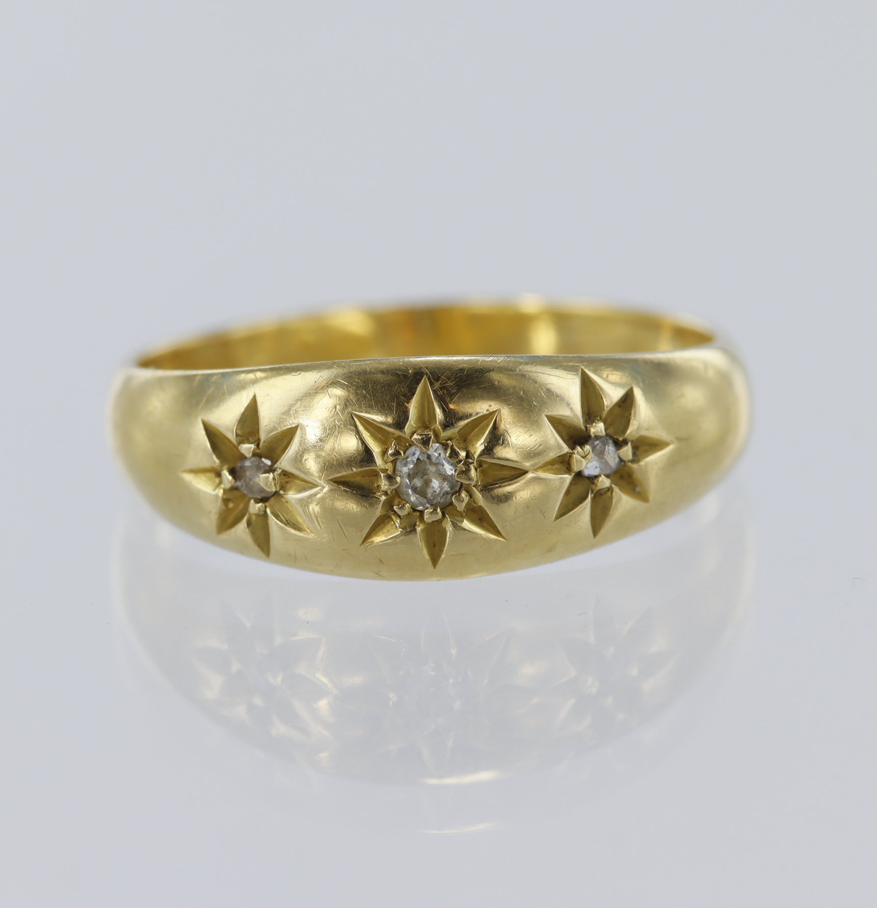 18ct yellow gold gypsy ring set with one old cut diamond and two rose-cut diamonds in a star