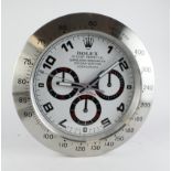 Advertising Wall Clock. Silver & white 'Rolex' style advertising wall clock, white dial reads 'Rolex